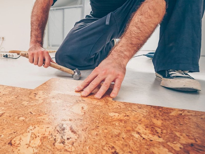 closeup of person installing cork flooring - Rickway Carpet in North Mankato, MN