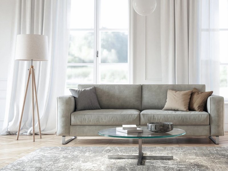 grey couch on area rug in living room - Rickway Carpet in North Mankato, MN